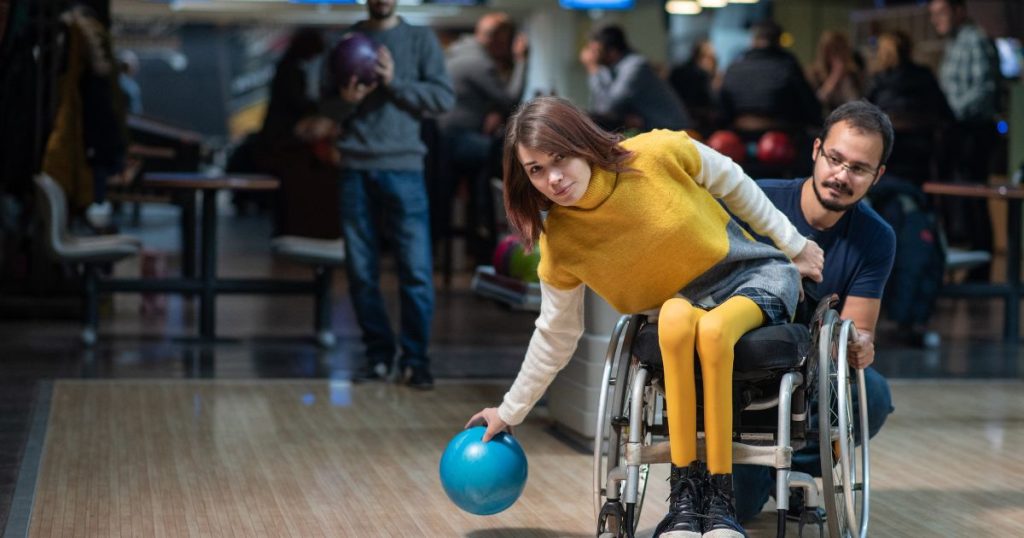 Disabled woman in a wheelchair bowling